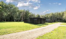 Existing Cabins Against Woodland
